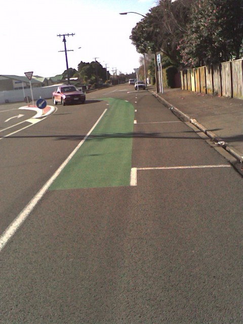 Green paint marking in cycle lanes: Top of Tukapa St and into Wallace Place