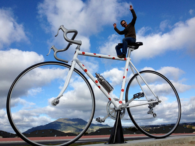 Giant cycle in Taupo: Photo caption: Artist Marcel Zwezerijnen created a three metre high sculpture permanently sited at the Northern entrance of Taupo to inform locals and visitors that Taupo is a cycling town and remind drivers they need to be aware of cyclists on our roads