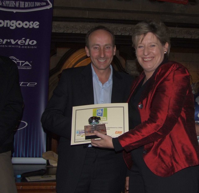 Gerry Dance receiving award from the Hon. Lianne Dalziel