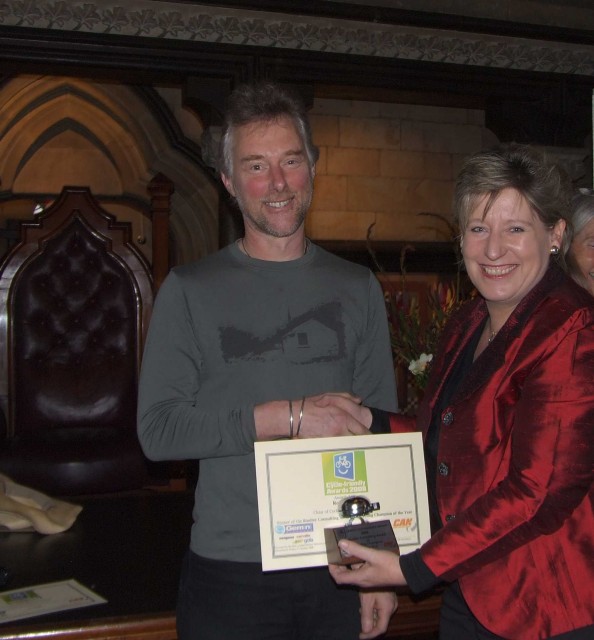 Robert Ibell receiving award from the Hon. Lianne Dalziel
